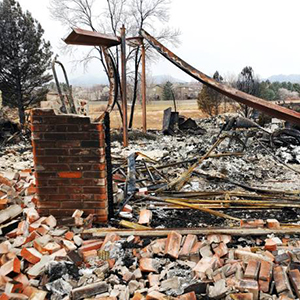 Superior, Colorado, USA-January 21, 2022: Ruins of a burned house and garage as a result of a December 30, 2021 wildfire.